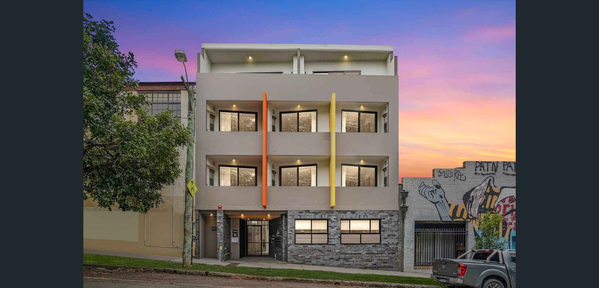 Twilight facade of the completed building at 327 Trafalgar St, Petersham