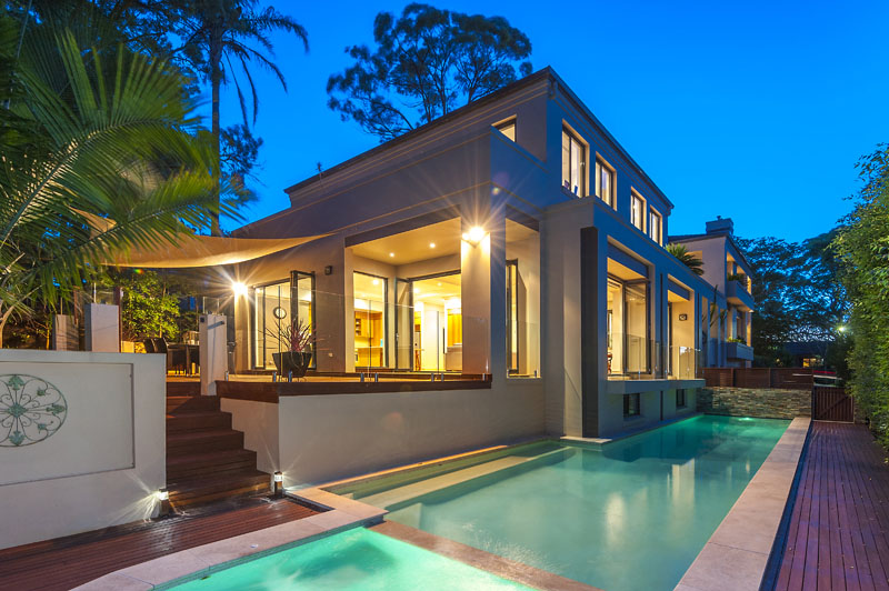 Twilight pool and garden of the completed home at 35 Warrimoo Ave, St Ives