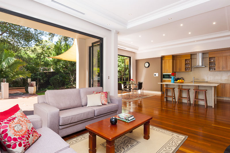 Family living area flowing to outdoor entertaining at 35 Warrimoo Ave, St Ives