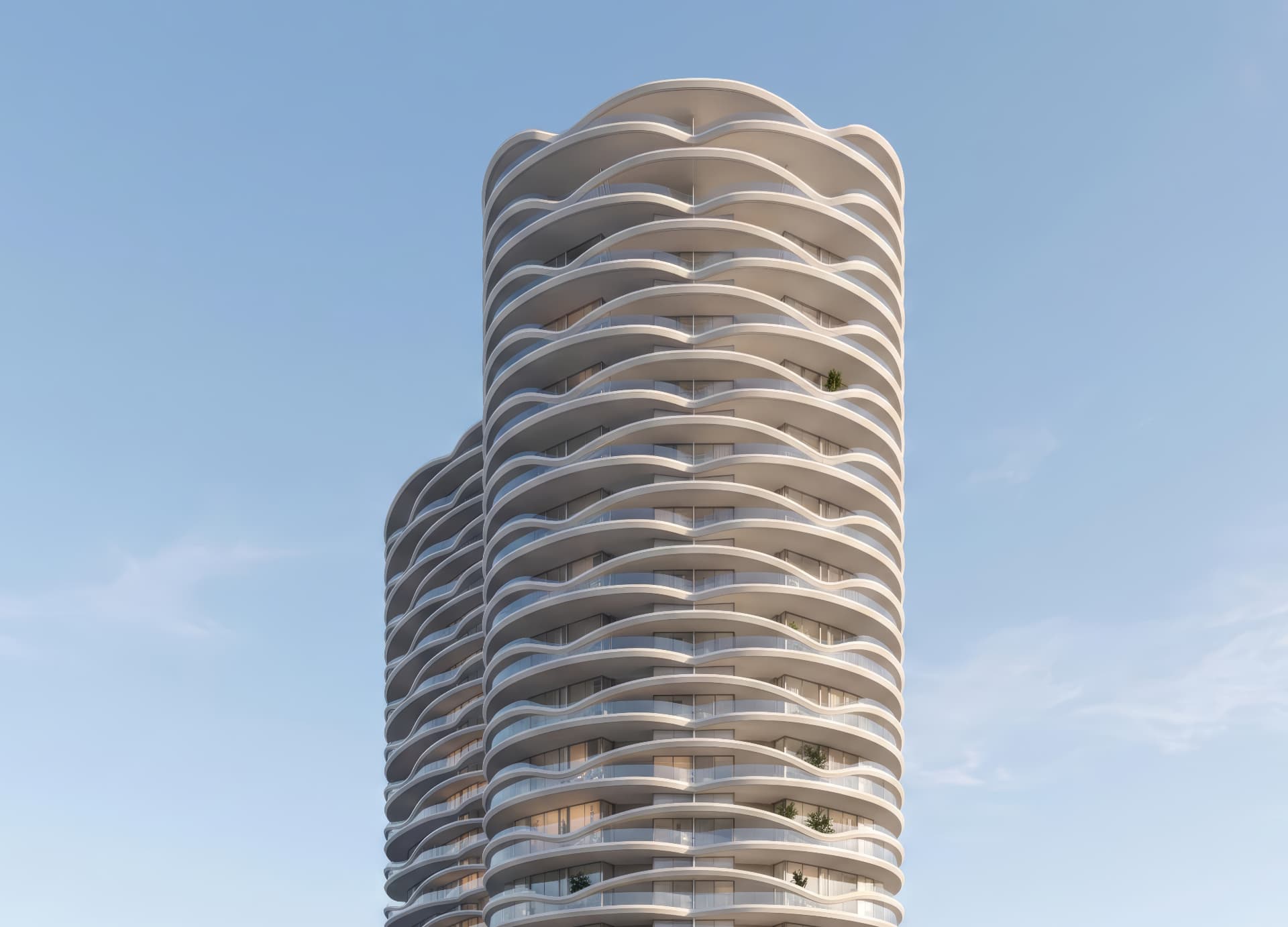 Low-angle view of the undulating wave-form balconies and glass railings of Scarborough & Queen Towers against a clear sky, Southport